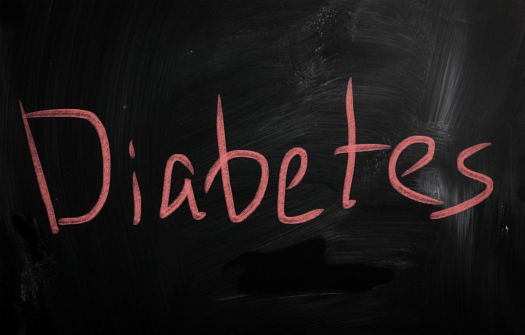 the word diabetes is written on a chalkboard