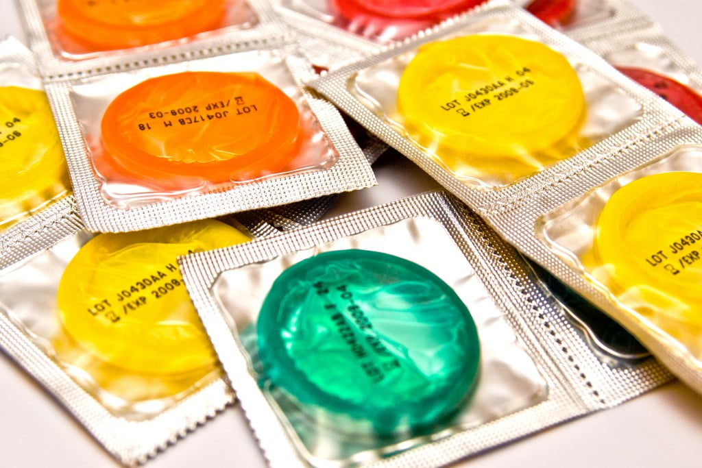 brightly coloured condoms in packets