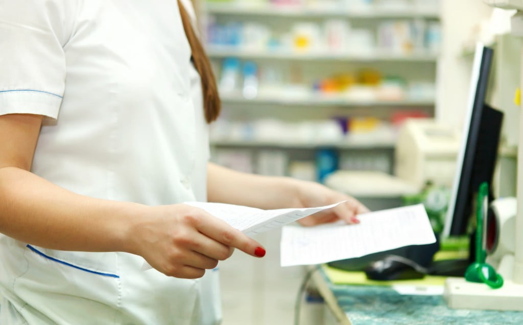 Advanced Practice Pharmacists pilot: pharmacist with script in dispensary