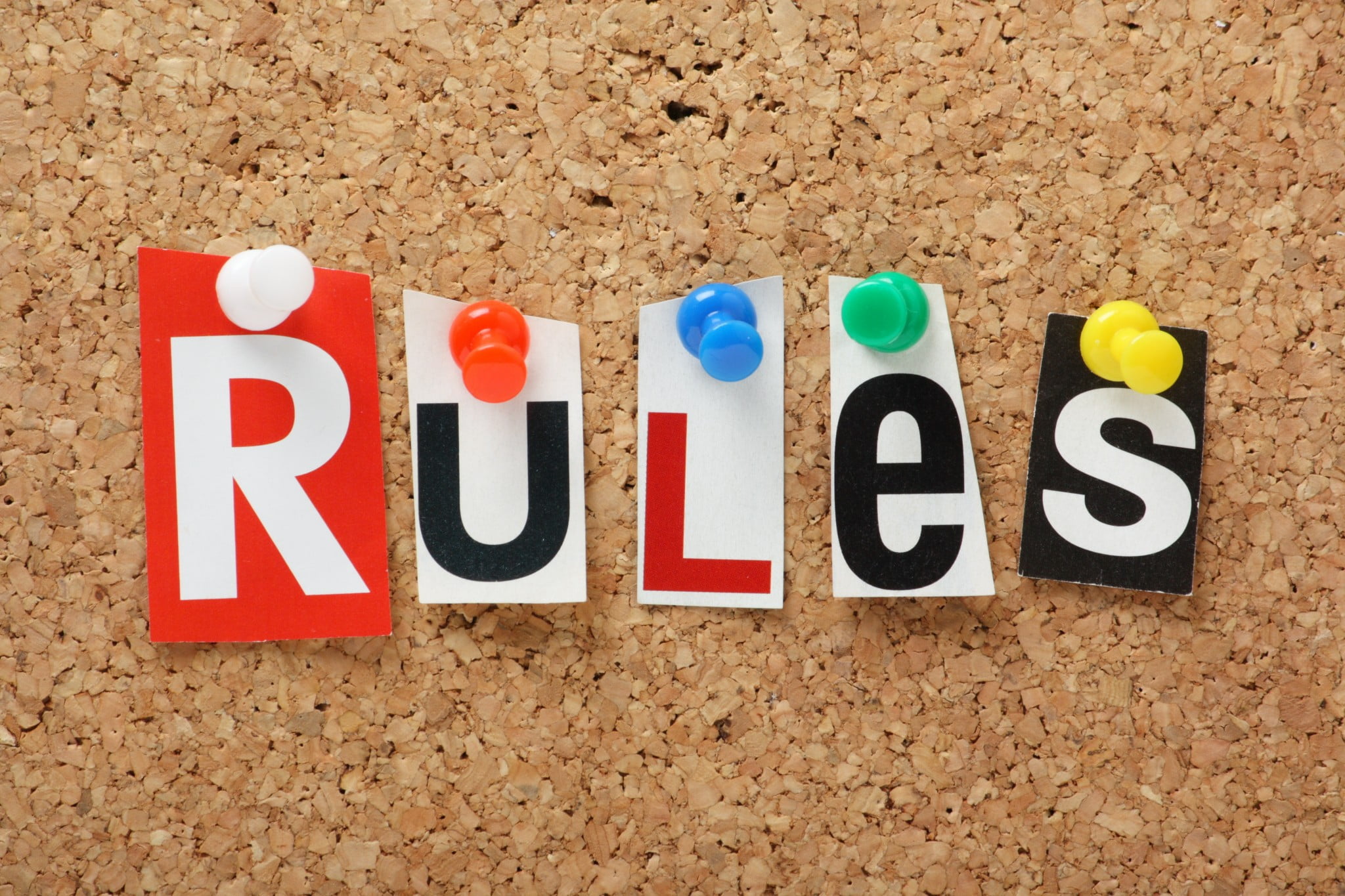 "rules" spelled out on corkboard