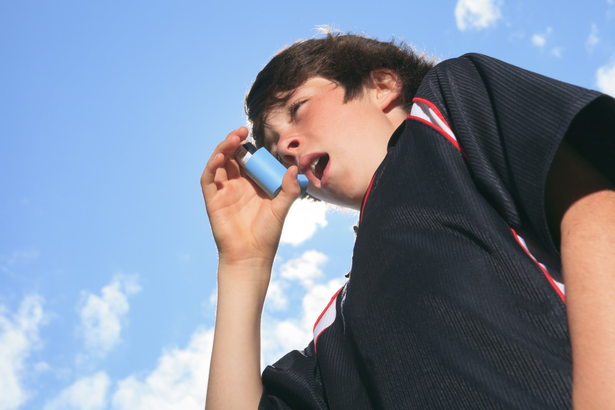 asthma: boy uses puffer