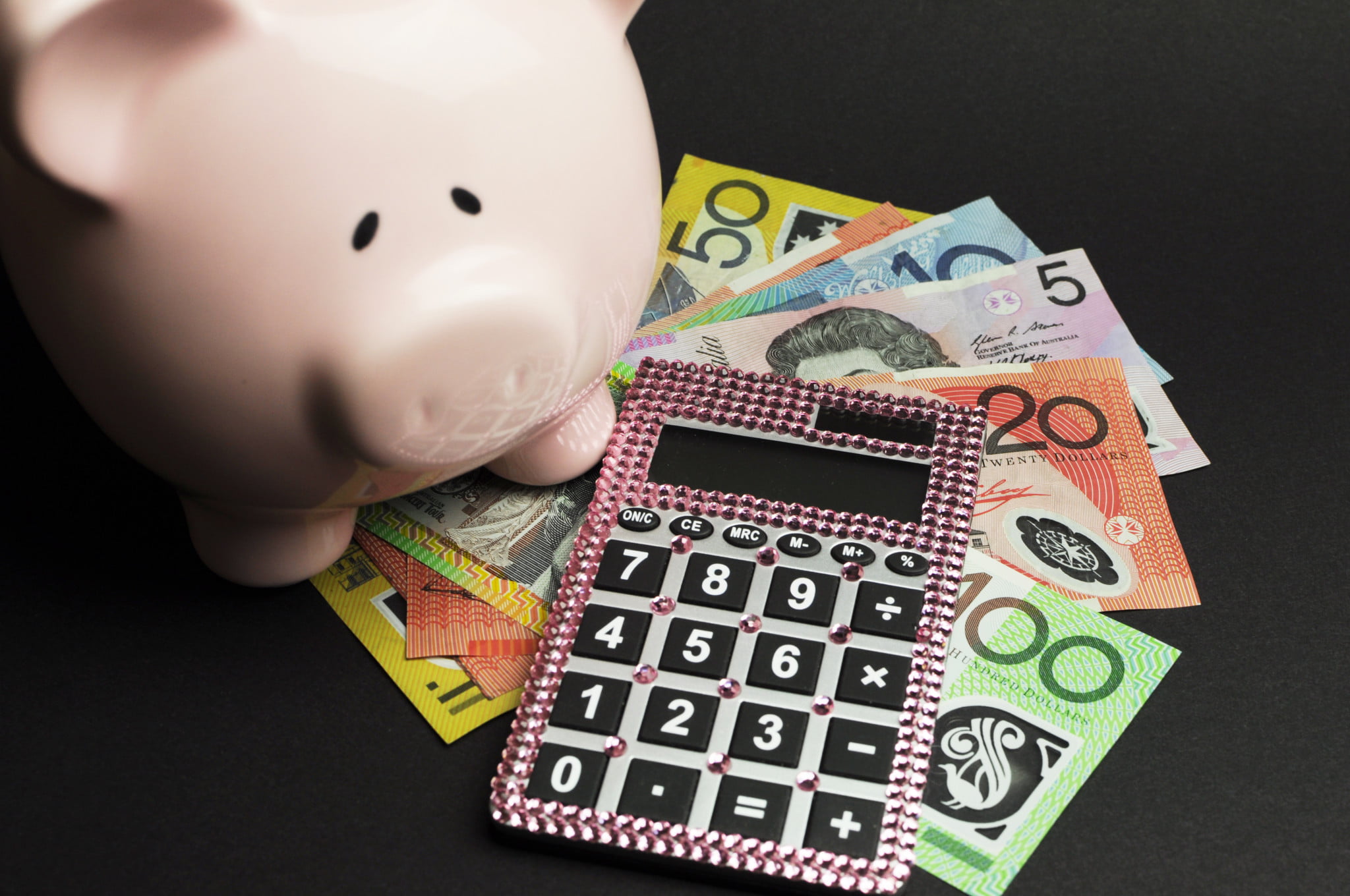 piggy bank, money and calculator