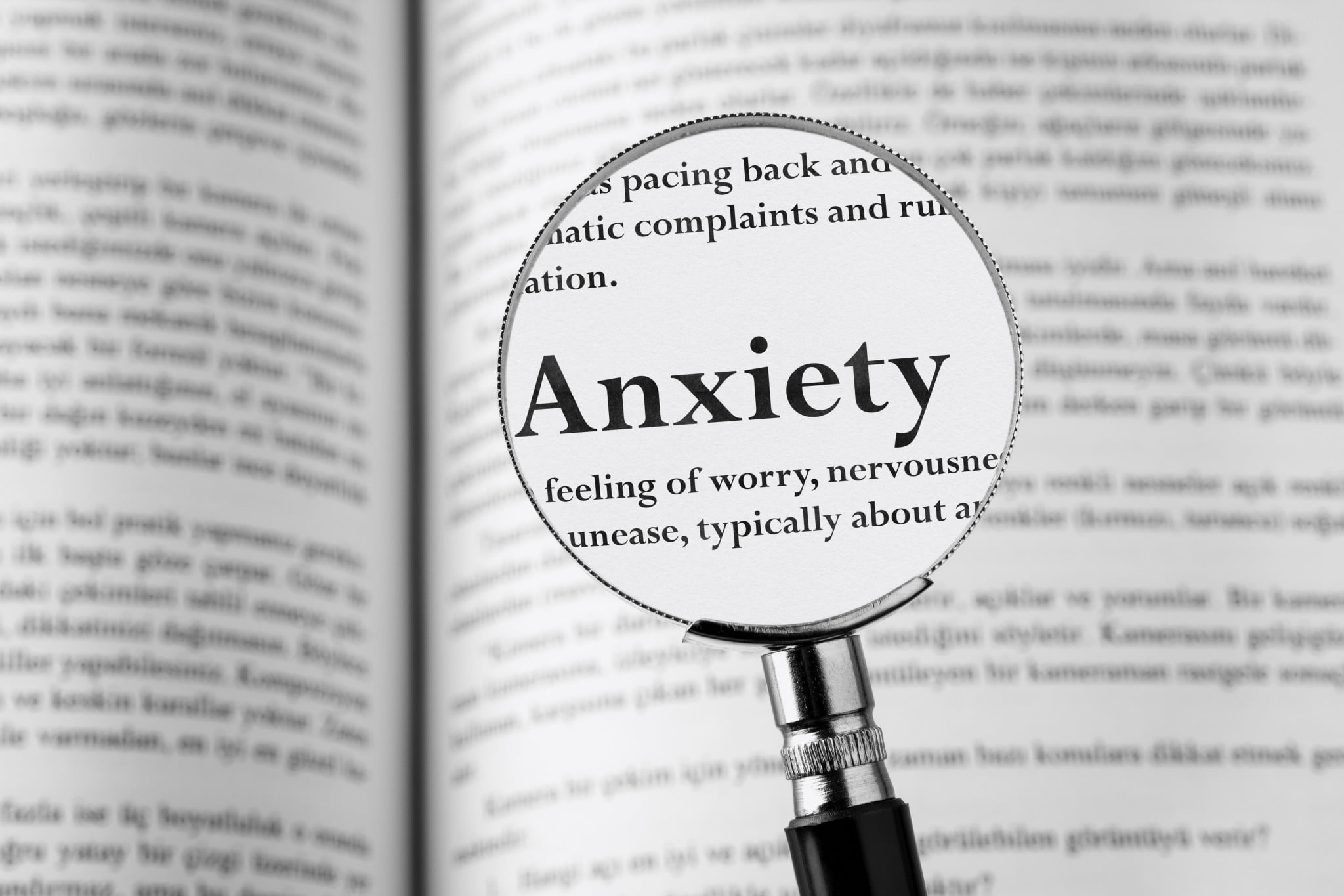 magnifying glass over the word "anxiety"
