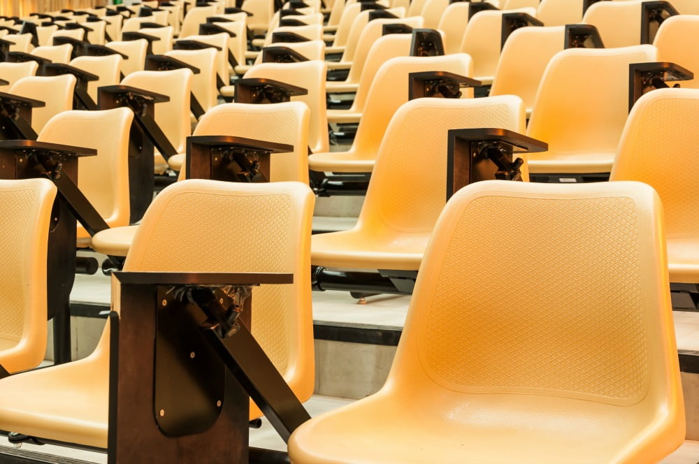 pharmacy graduates - empty chairs in a lecture theatre