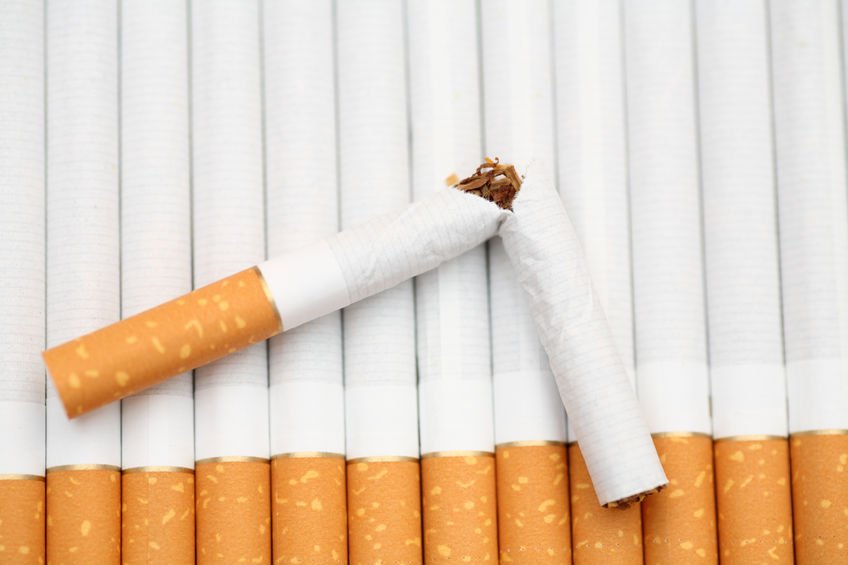 quit smoking: rows of cigarettes with one broken