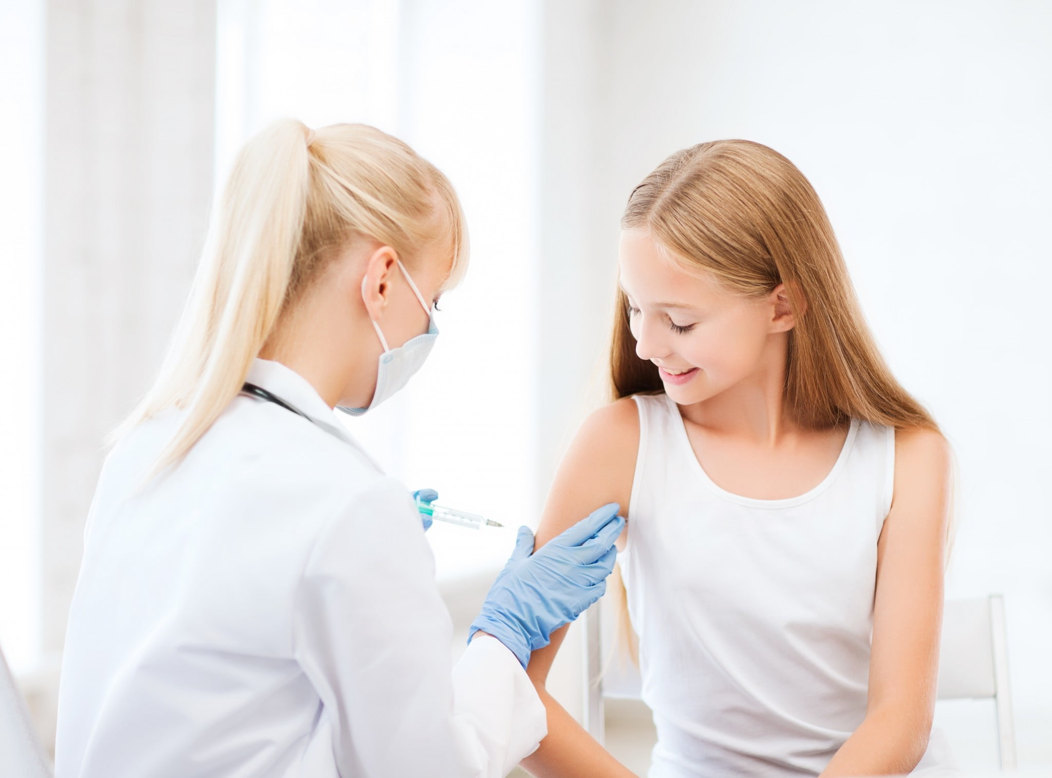 teenage girl getting vaccine, possible HPV vaccine