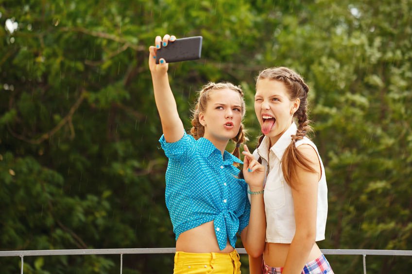 young people (girls) taking selfie