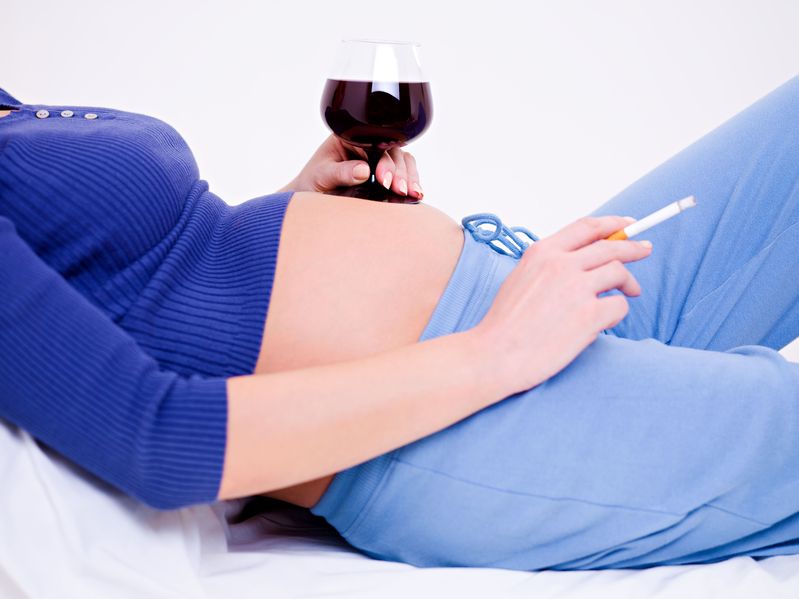 pregnant woman with wine and cigarette