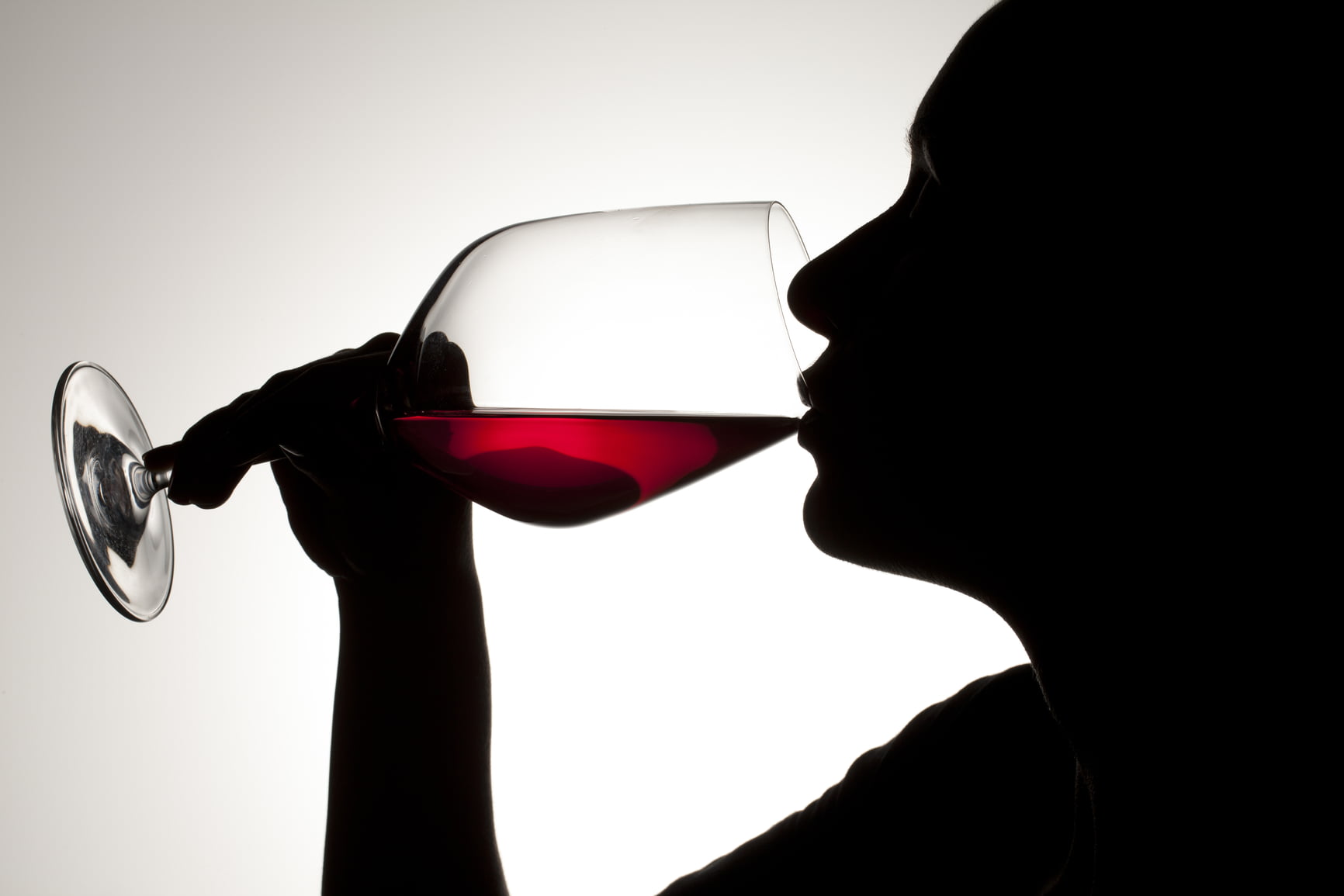silhouette of person drinking wine