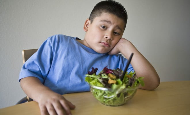 overweight boy with salad