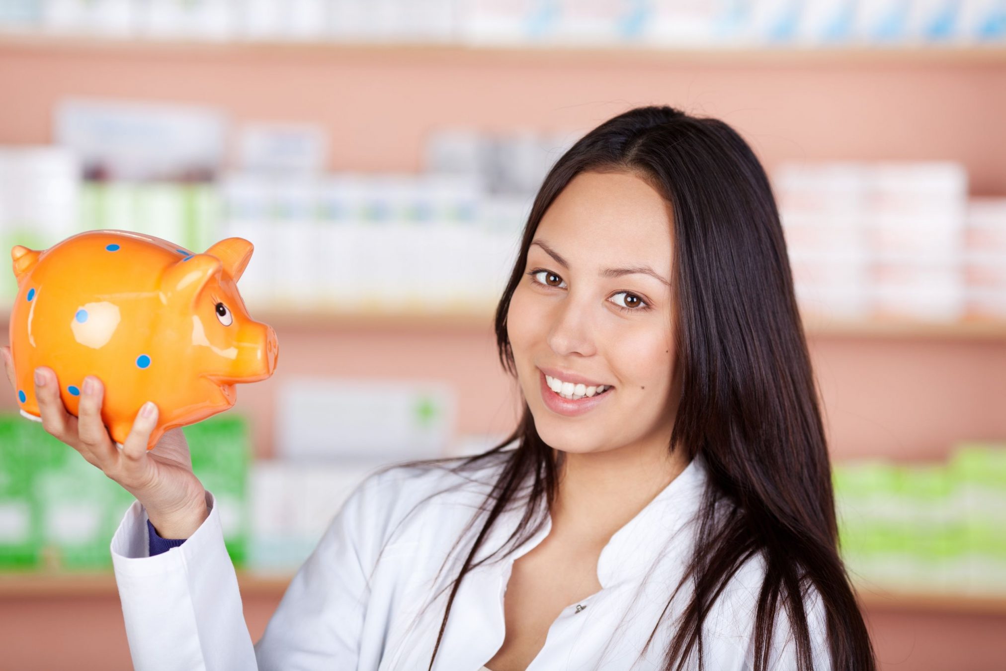 pharmacist holding piggy bank