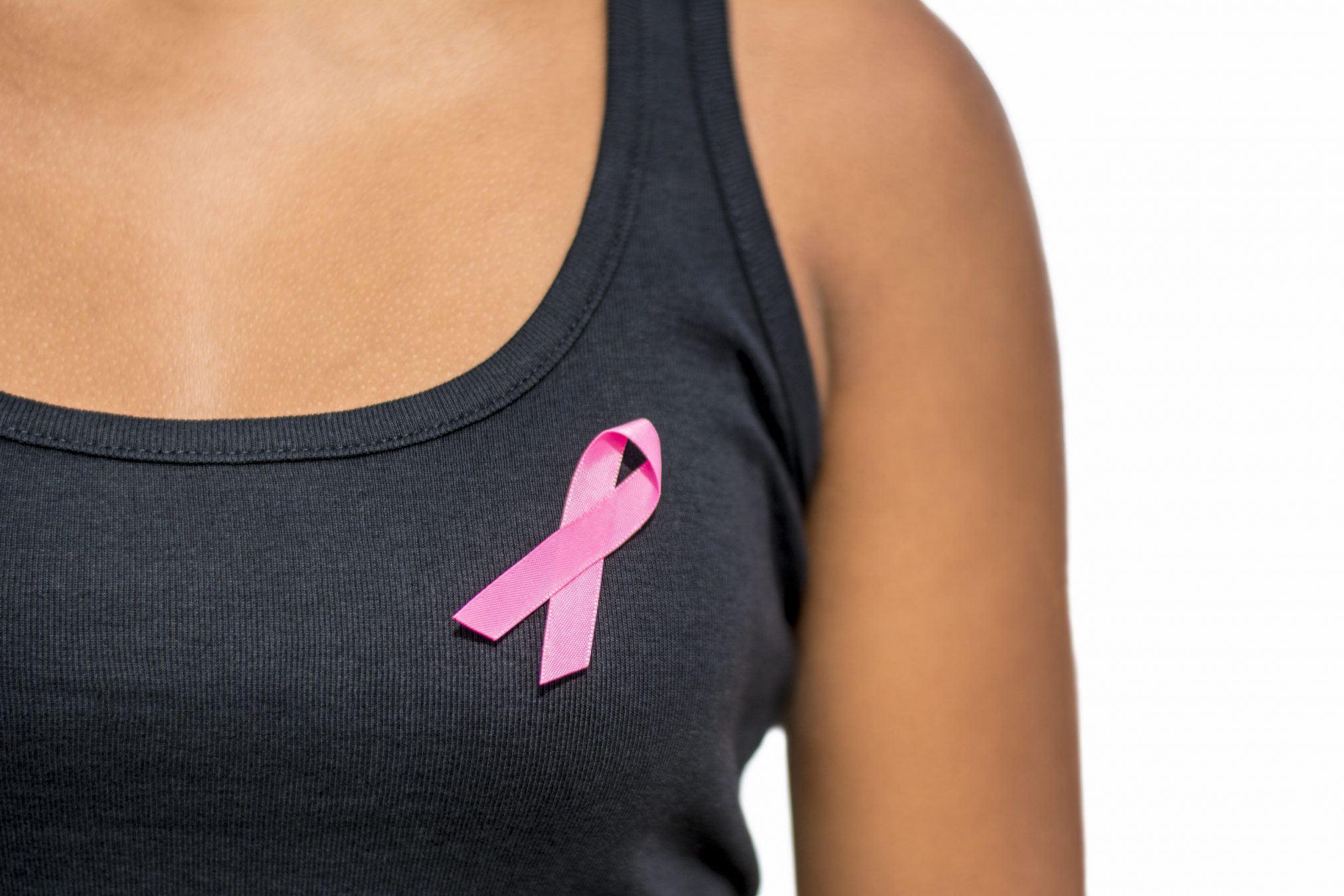 woman wearing breast cancer ribbon
