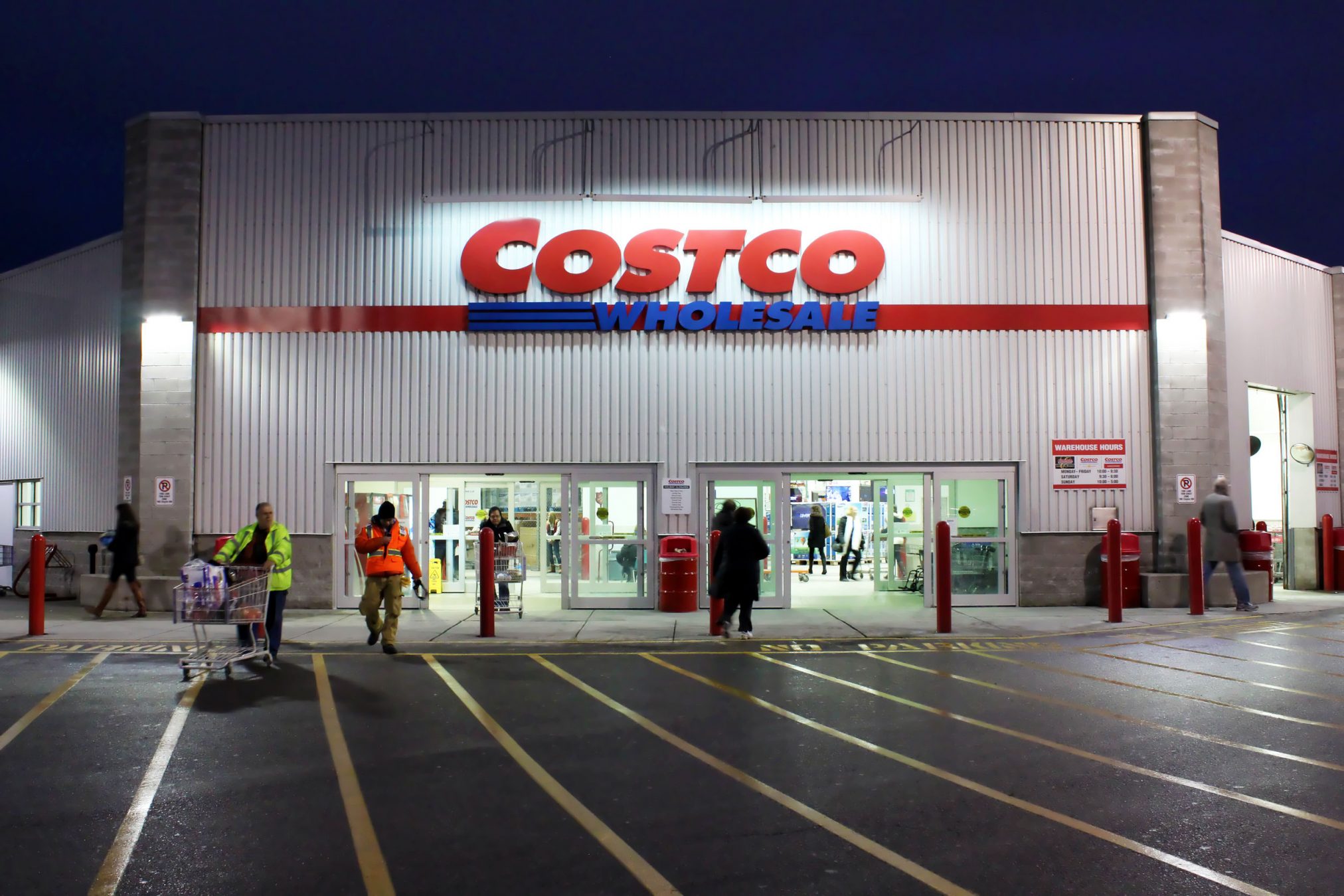 costco storefront lit at dusk