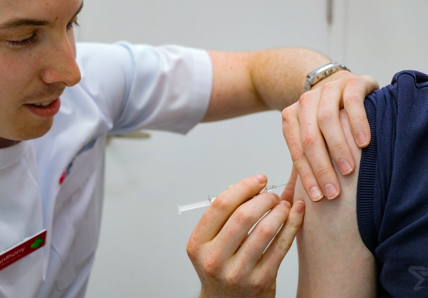 Pharmacist administers a vaccine. Source: PSA.