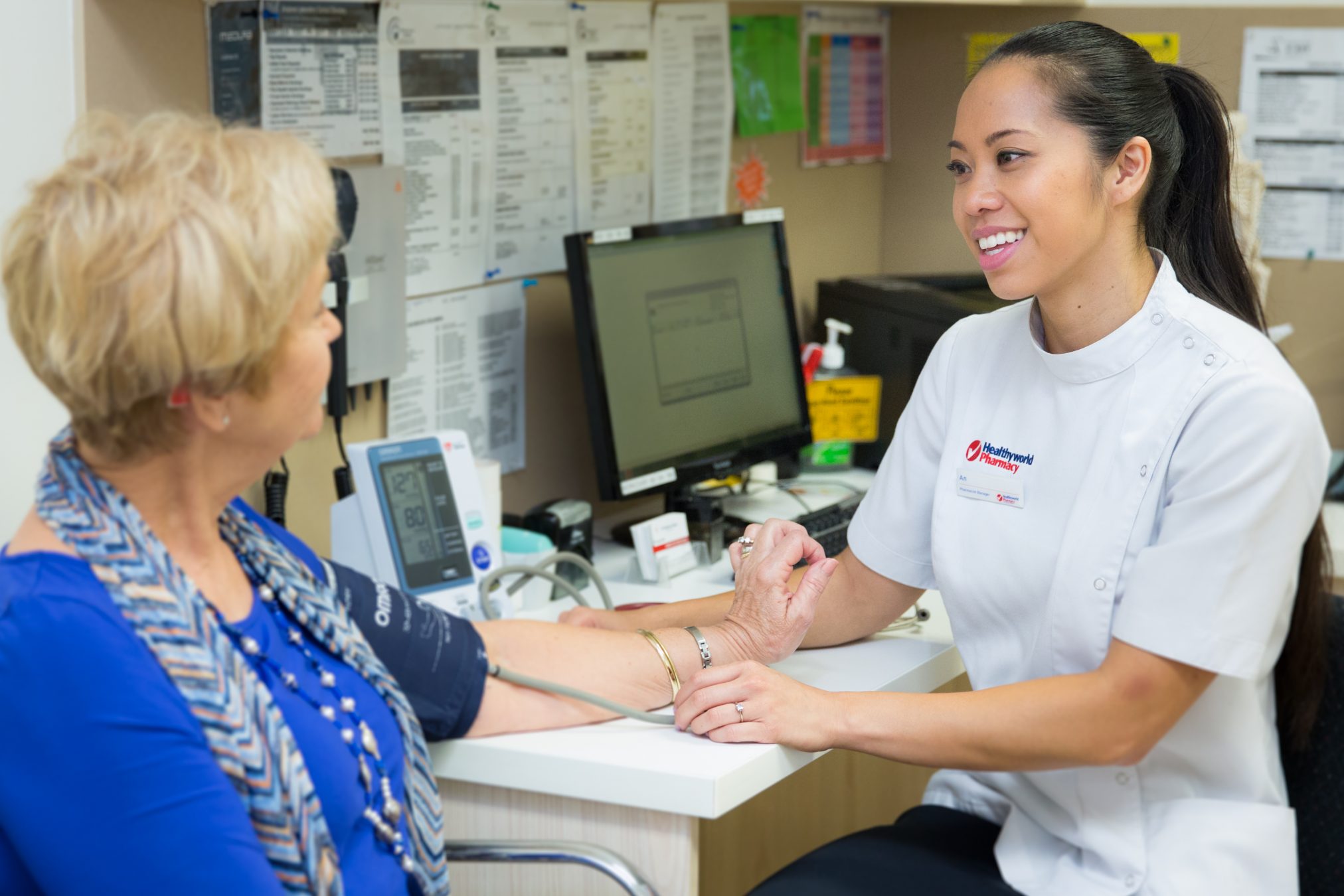 Female Pharmacist and Female Customer Consult Room Blood Pressure_4