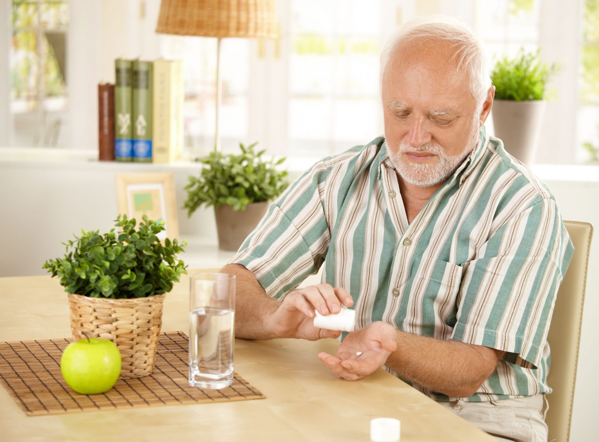 elderly man older man taking pill medicine medication viagra ED drug sildenafil