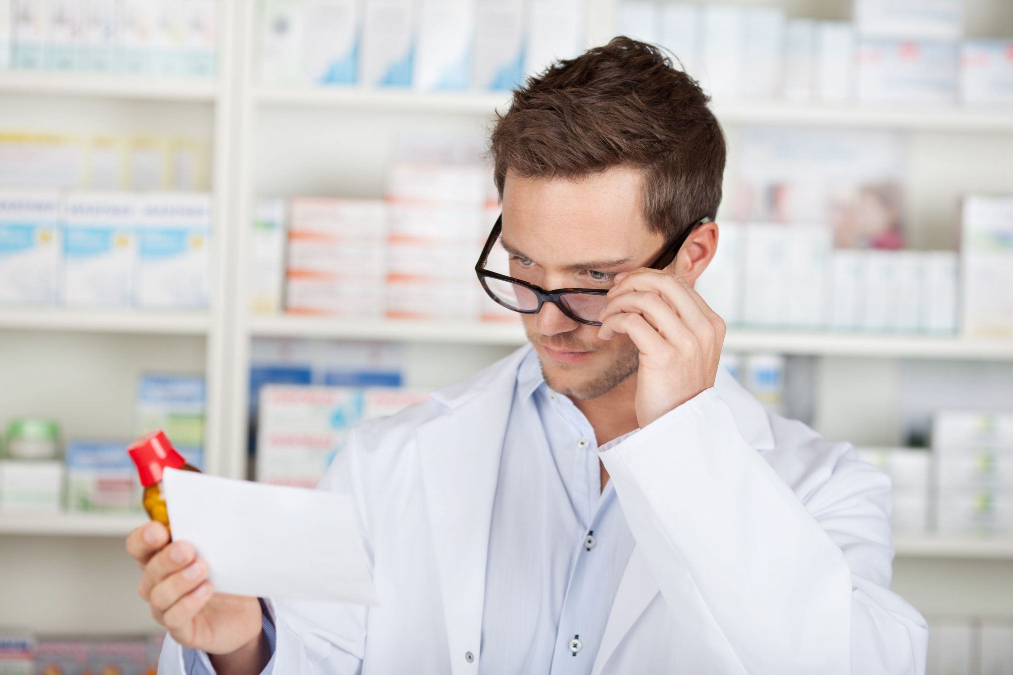 pharmacist double checking prescription