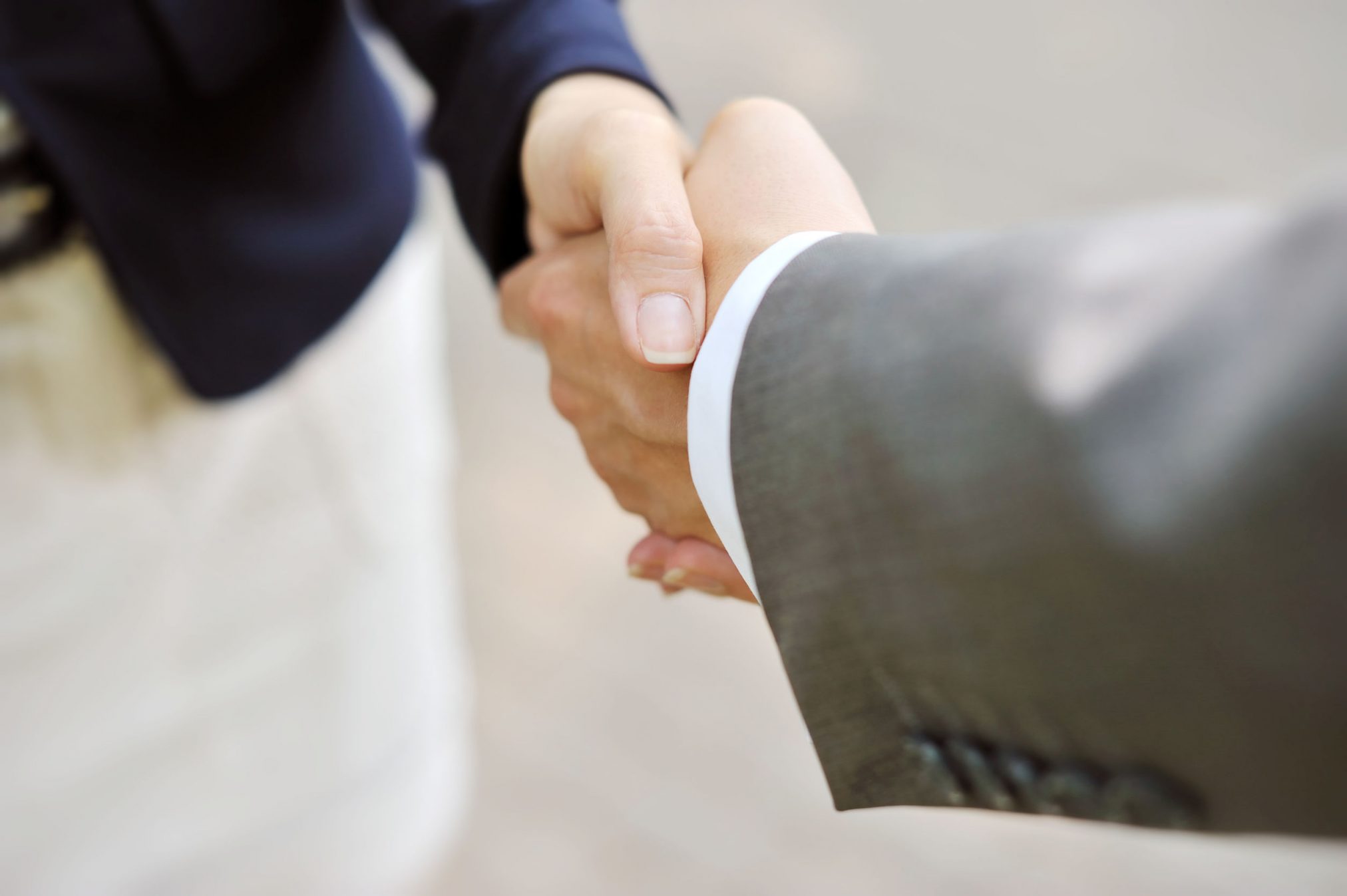 shaking hands handshake business deal partnership