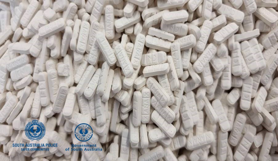 many white tablets stamped "Xanax"
