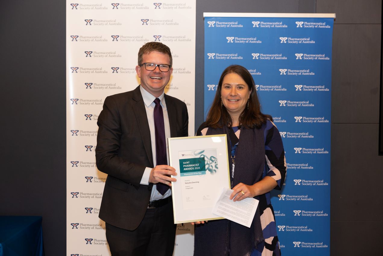 Natasha Downing receives her award from SA health minister Chris Picton
